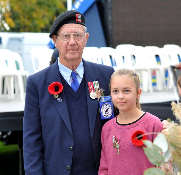 PROUD: Former National Serviceman George Cameron with his great-grand daughter Lucy Nielson at the Anzac Day commemorations. 