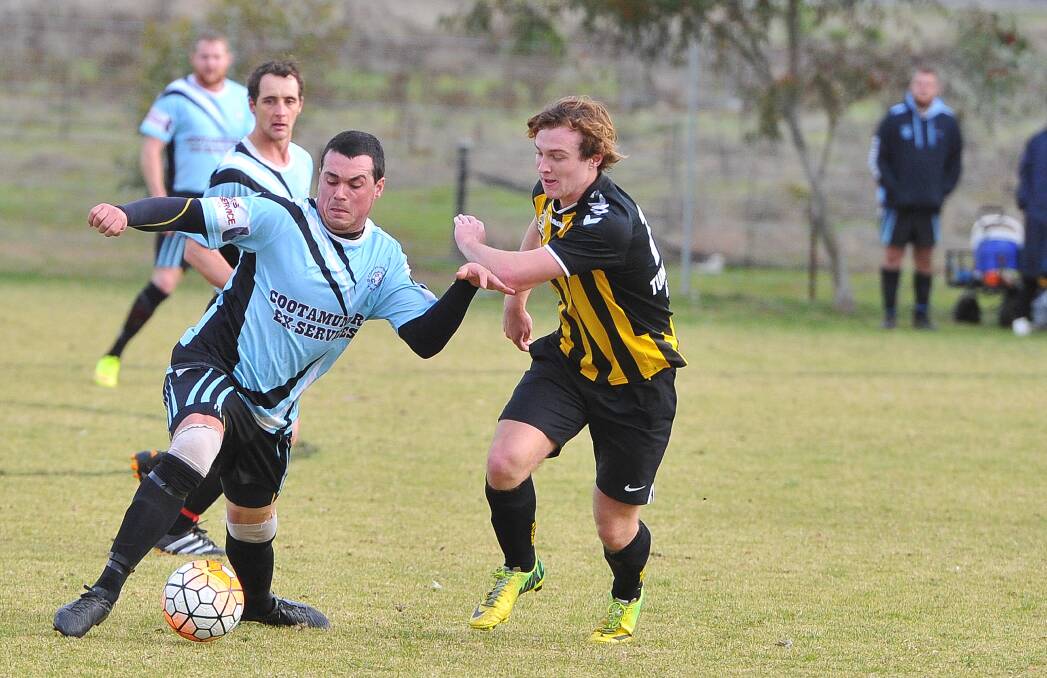 HARD AT IT: Cootamundra's Adam McPhail burning Tumut's Richard Creati in the Strikers' 7-1 victory at O'Connor Park in June. Picture: Kieren L. Tilly