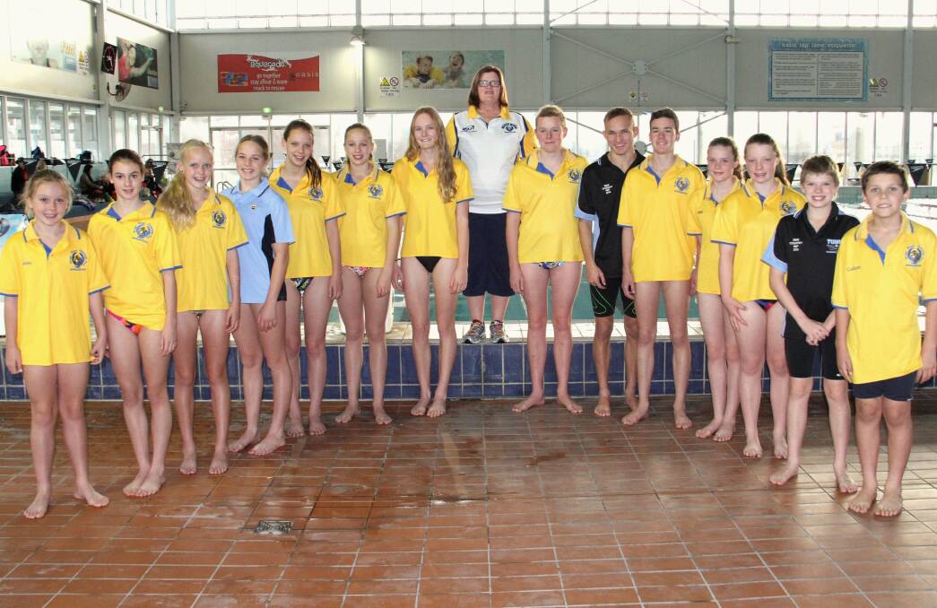 WAGGA ENTOURAGE: Coach Barb Blondinau (centre) and the impressive contingent of Wagga swimmers competing at a state competition in Sydney on the weekend.
