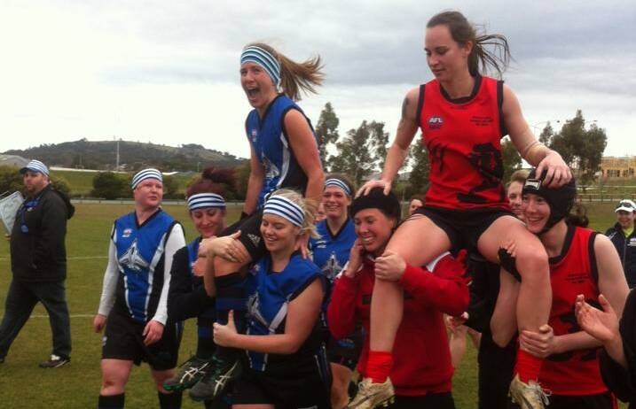 HONOURED: Riverina Lions (right) honour Kahli Abbott for playing 100 games alongside Gungahlin players also celebrating a milestone in Canberra on Saturday.