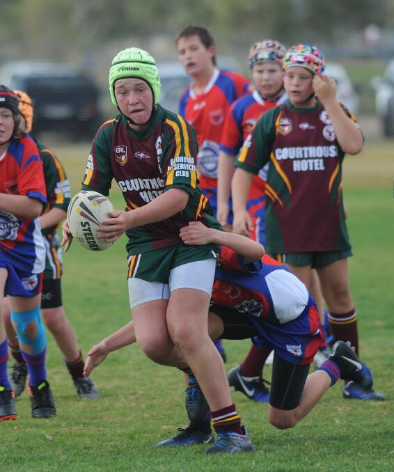 TACKLE: Kangaroos' Joseph Cole tackles Harden's Cooper Cross, looking to offload, as the Kangaroos play against Harden/Boorowa in under 13's rugby league in Wagga on Saturday. Picture: Laura Hardwick