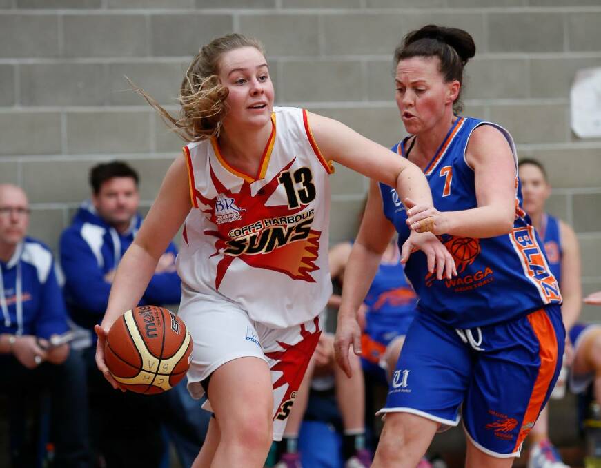 DEFENCE: Wagga Blaze captain Nicole McPherson guarding a Coffs Harbour player in Wagga's two-point victory over the Suns in Minto last week. Picture: Geoff Tripp