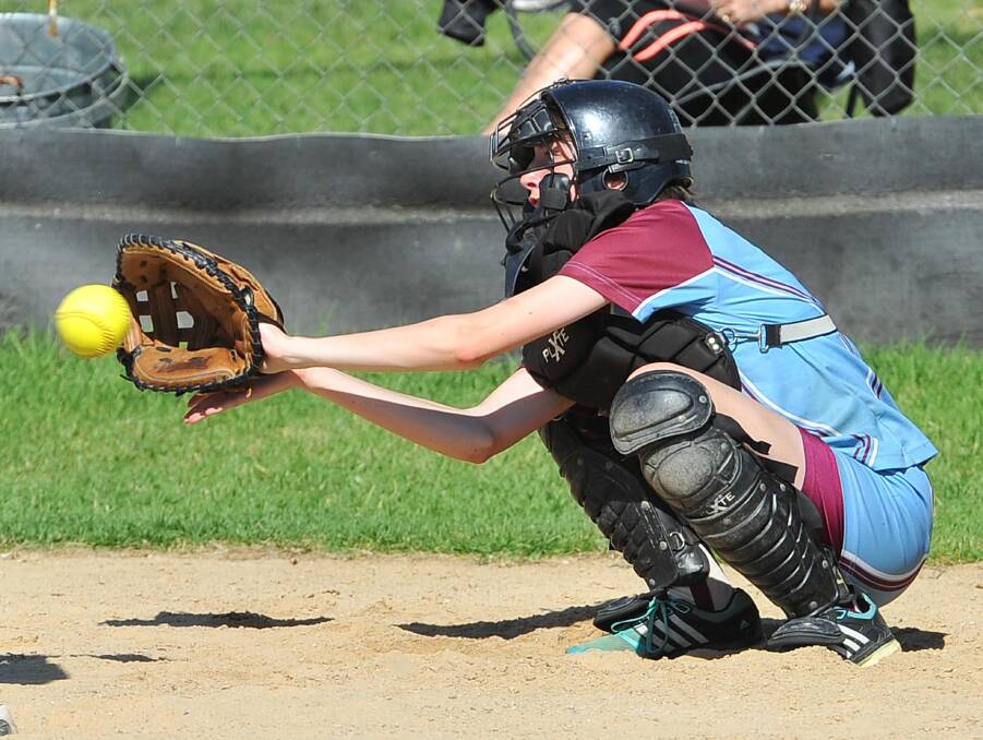 IN SAFE HANDS: Lake Albert catcher Amy Cottee getting low at Frenchs Fields in the women's softball on Saturday. Picture: Kieren L. Tilly