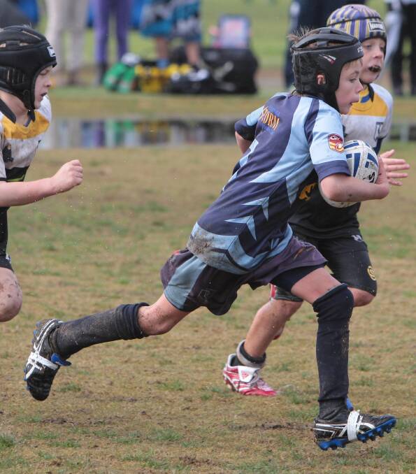 Wodonga Storm's Jaxon Coleman escapes the Wagga Magpies in the under 8 rugby league at Parramore Park. Picture: Les Smith
