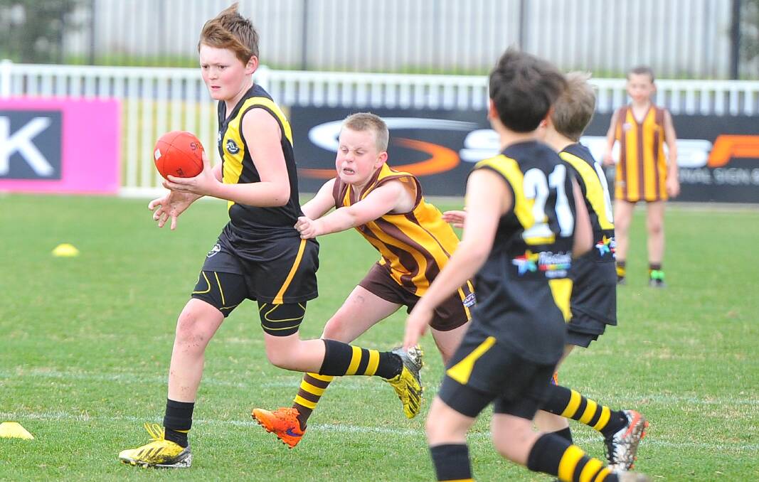 Ethan Drum under pressure in the under 10s game, as Wagga Tigers face the Hawks on August 7. Picture: Kieren L. Tilly