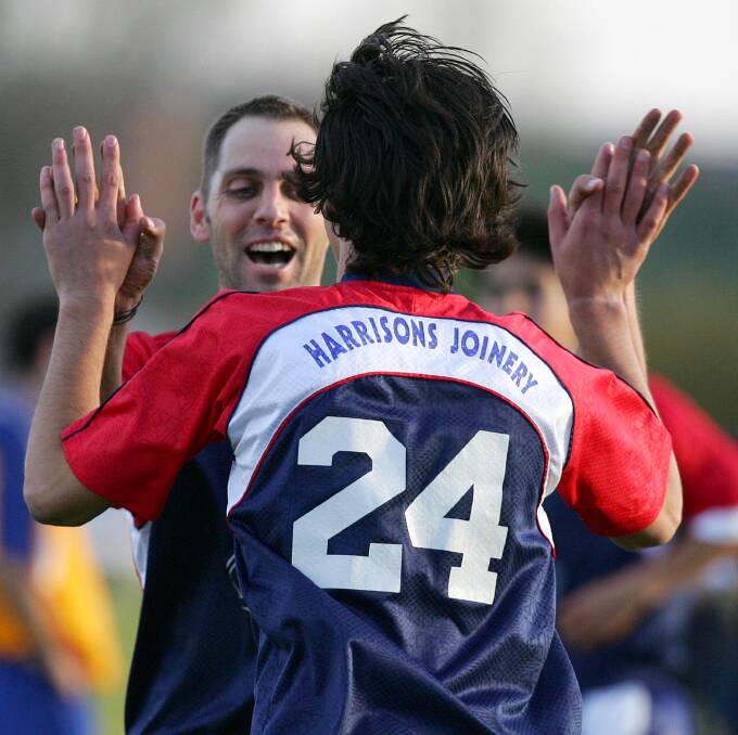 Peter Adams celebrates a goal with his Henwood Park team-mate in 2005. Adams will coach Henwood Park women's squad in 2017.