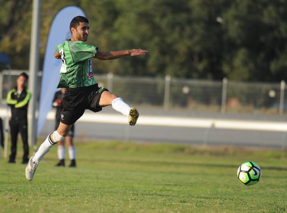 FLYING: South Wagga's Nazar Yasif chips the ball forward, in his team's 4-0 win over Tumut at the Showgrounds on Sunday. Picture: Laura Hardwick