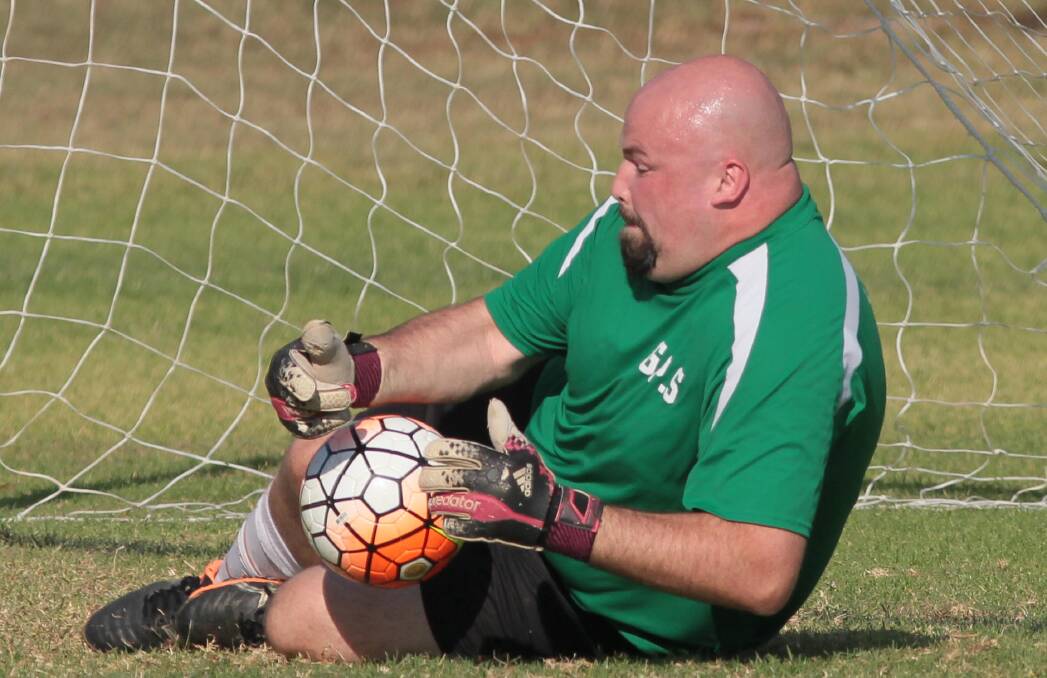 IN SAFE HANDS: Wagga United goalkeeper Andrew McCracken prevents Tolland from scoring off a penalty in the most memorable game of the season. Picture: Les Smith