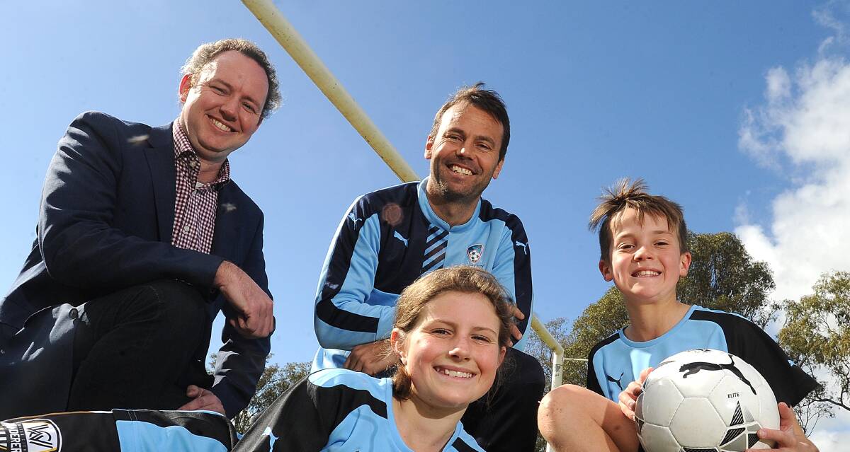BRIGHT FUTURE: (Back) Football Wagga's Erwin Budde, Sydney FC's Paul Reid and Wagga player Caelan Gray, 11. (Front) Wagga player Gemma Sutcliffe, 11. Picture: Laura Hardwick