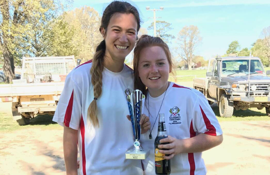 TEAMMATES: SIRU seven's representative players Billie Deacon and Sara Smart with the winner's trophy. Smart proved a handy late addition to the squad in early October