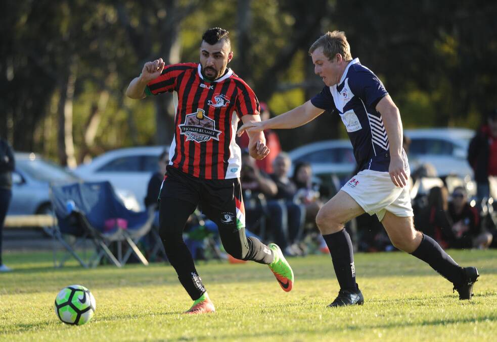 INJURED: Young's captain Duncan Cameron (right) playing Lake Albert. His shoulder's injured and he may rest as the squad plays Junee on Sunday. Picture: Laura Hardwick