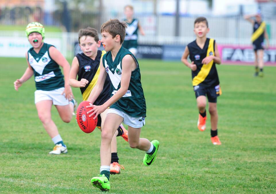 DISPOSAL: Jack Rudd about to kick the ball in the under 11's Australian rules as Wagga Tigers play Coolamon at Robertson Oval on Saturday. Picture: Kieren L. Tilly