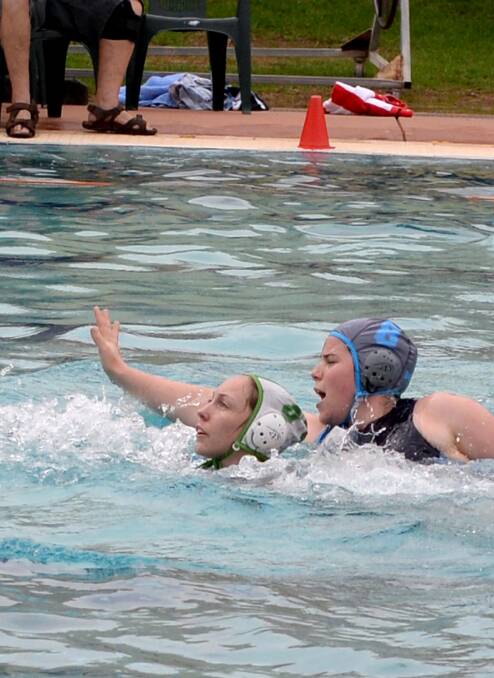 Dolphins veteran Samantha Neal hits the back of the net at Oasis in 2014.