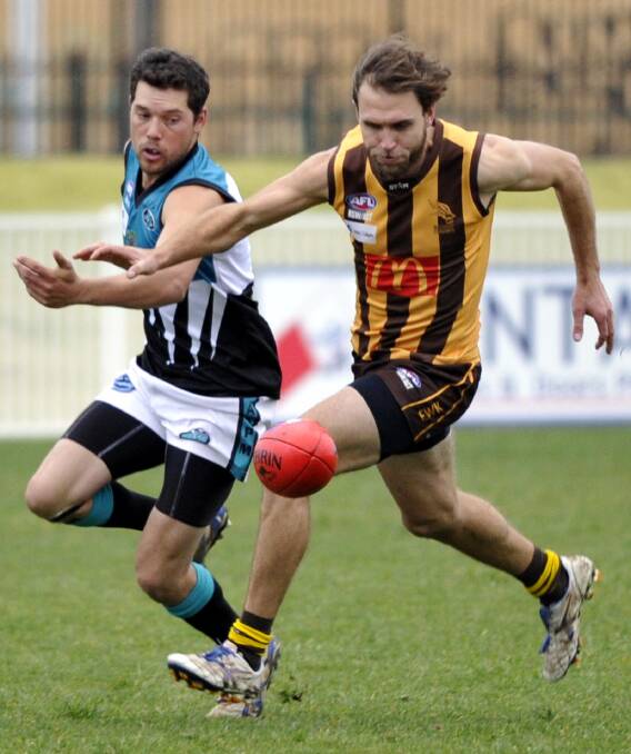 DOMINANCE: East Wagga-Kooringal's pace-setter Stuart Brierty shields Northern Jets player Brad Moye from the ball and claims possession at Robertson Oval on Saturday. Picture: Les Smith
