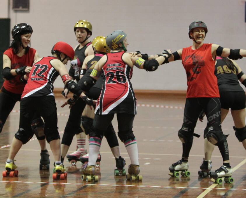 BLOCKING KINGSTON: Murderous Crows create a wall to block out their opponents at the roller derby bout at Bolton Park on Saturday. Picture: Les Smith