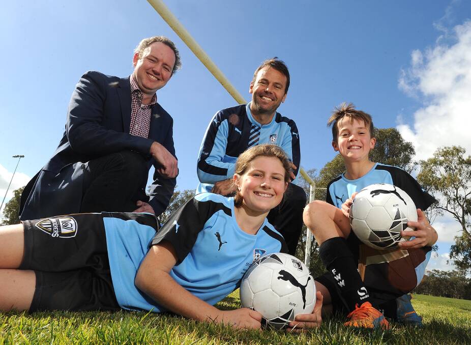 (Back) Erwin Budde, Paul Reid, Caelan Gray, 11, (front) Gemma Sutcliffe, 11, as Football Wagga signs a partnership with Sydney FC in August. Picture: Laura Hardwick