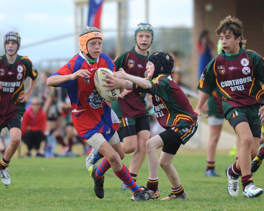 ON THE RUN: Angus Curry not too concerned by Hamish Minehan as the Kangaroos play against Harden/Boorowa in under 13's rugby league in Wagga on Saturday. Picture: Laura Hardwick