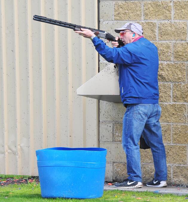 TAKING AIM: Gil Farish from Benalla shooting clay targets at the State Skeet Shooting Championships in Wagga on Friday. Picture: Kieren L. Tilly