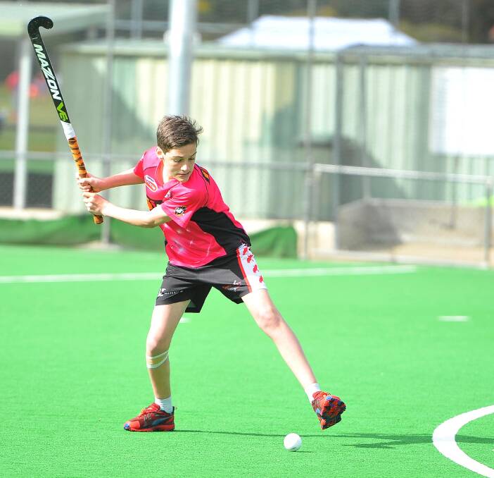 IRON'S HOT: Harlequins player Mitchell Foster, 14, in the junior hockey tournament at Jubilee Park on Sunday. Picture: Kieren L. Tilly