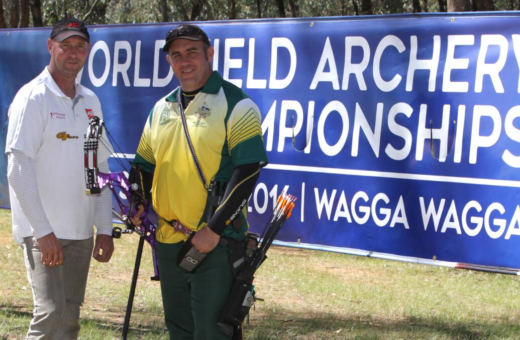 BEST OF FRIENDS: A Grade freestyle unlimited elite profile archers Shaun Pratt, Melbourne, and Justin Olexienko, Brisbane, at Wokelena Range on Wednesday. Picture: Les Smith
