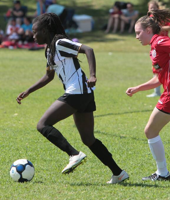 IN CONTROL: Biola Dawa playing for Wagga in an exhibition match against Canberra FC in March. She is off to College in the US after she is fnished her HSC. Picture: Les Smith