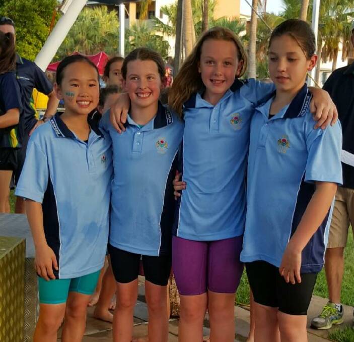 LOCAL LEGEND: South Wagga Public's Abbey Senior, 10, (third from left) celebrates with a successful NSW squad. Senior brings home two golds and two silvers from the national championships in Darwin.