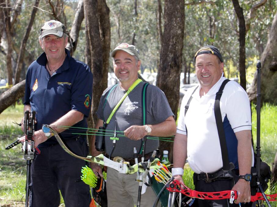 MANY NATIONS COMBINE: Alec James from Norfolk, England, Frank Burdi from Oceanport, USA and Jeff Bell from Drouin, VIC at Wokelena Range on Wednesday.