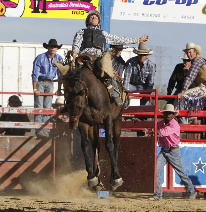 LOCAL ENTRANT: Tumut cowboy Dylan Weir in the saddle bronc at Wagga Pro Rodeo in January. Weir's tipped to be a crowd favourite at the Tumut Rodeo on Saturday. Picture: Les Smith