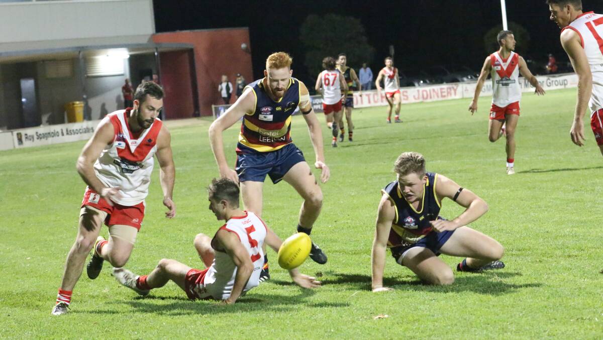 FIGHTING HARD: Crows pair Sam Cooper and Mason Dryburgh look to get possession of the footy against Griffith in season opener. PHOTO: Anthony Stipo