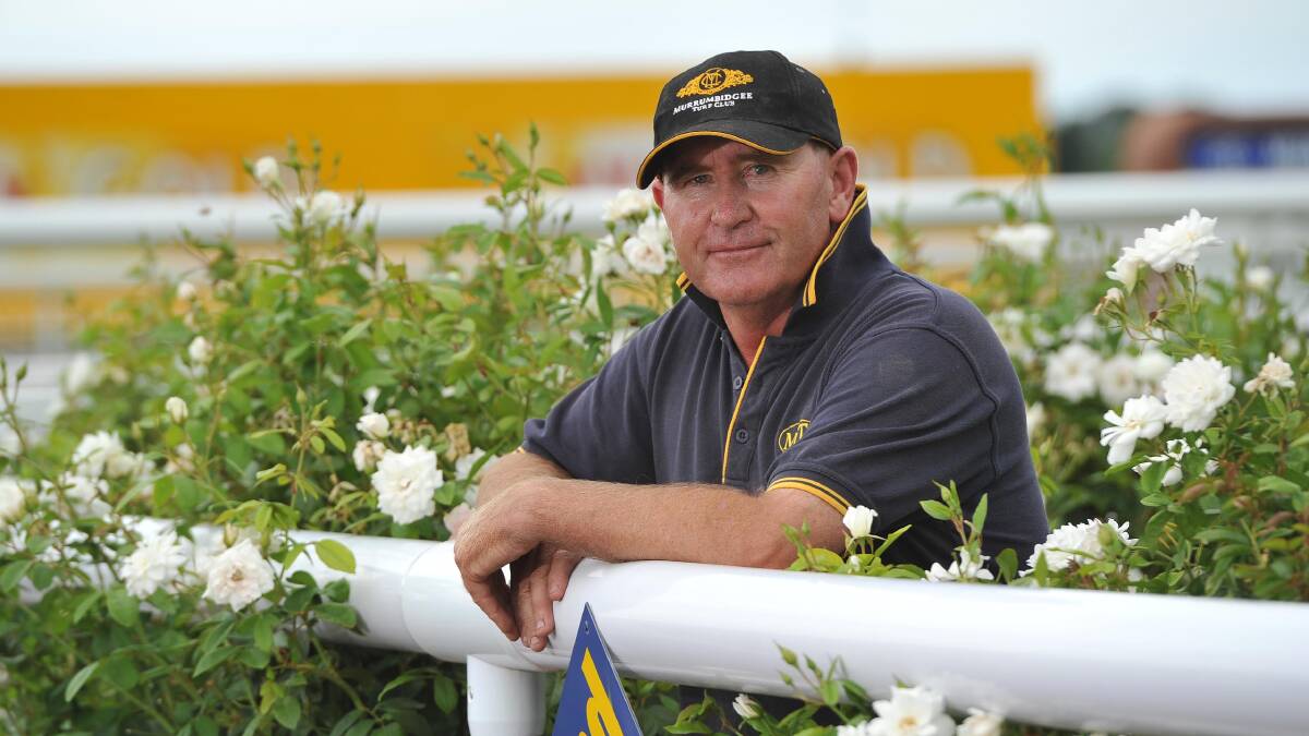 GREEN THUMB: MTC track manager Mark Hart believes the key to a perfect mow is slow speed and sharp blades. Picture: Laura Hardwick 