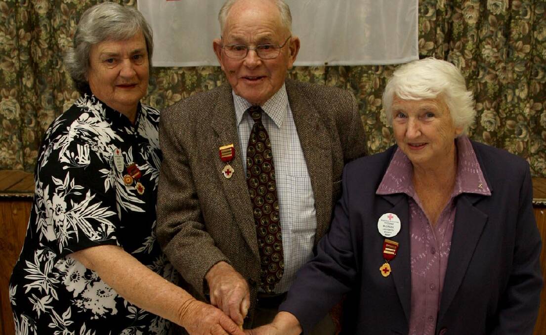 DAYS GONE: Marie Wilson, Jim Reynolds and Yvonne McGrane celebrate Ladysmith Red Cross' 70th anniversary in 2009. The branch has had to call it quits.