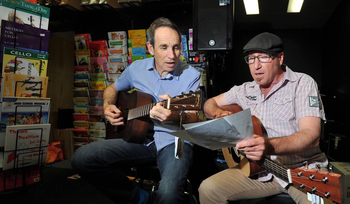 TUNE DE FORCE: Dale Allison and Scott Cochrane work on their song The World Sang La Marseillaise. Picture: Kieren L Tilly