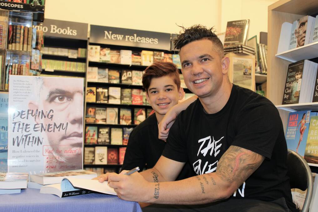 Off the shelf: Wagga man, sportsman and mental health advocate Joe Williams, with his son Brodi Williams, 13, launched his revealing autobiography in Wagga. 
