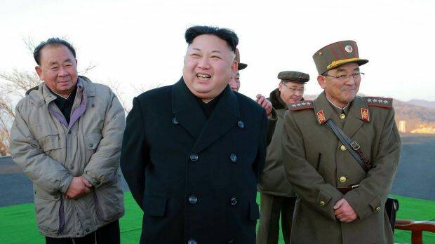 Kim Jong-un, centre, smiles during a missile launch in March. Photo: AP