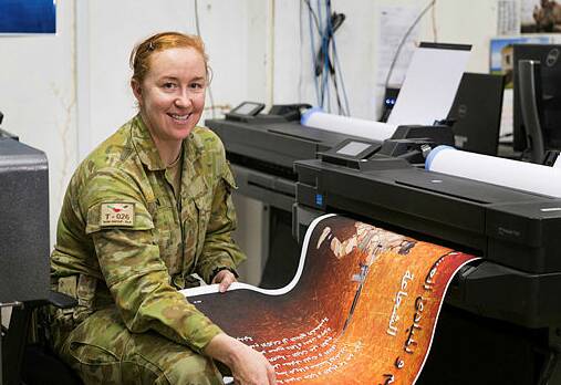 Matong to Iraq: Australian Army soldier Sapper Bronwyn Camin from Task Group Taji 4, printing a media product at Taji Military Complex.
