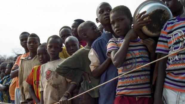 Fight to survive: South Sudanese children wait for food at the Bidi Bidi refugee camp over the border in Uganda.