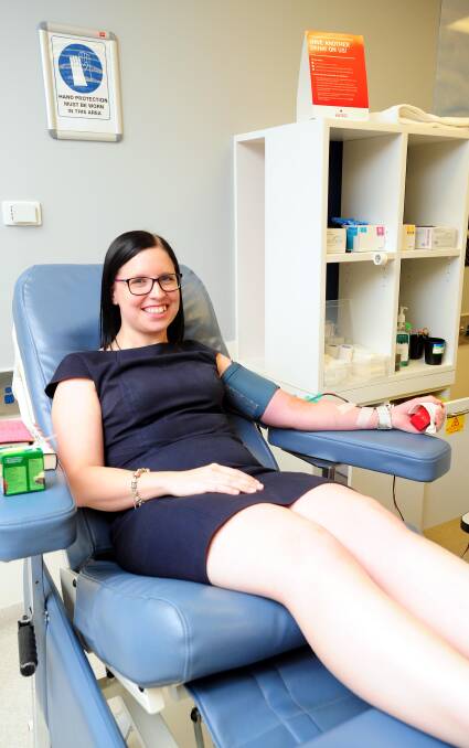 SMALL SACRIFICE: Bush and Campbell client services manager and regular blood donor Yana Constable urged those eligible to donate and save lives. Picture: Kieren Tilly 