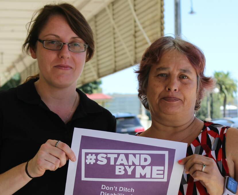 Stand by me: Wagga's Regional Disability Support Advocacy group fears state-government funding cuts could hurt Riverina residents like Joy Taber (r). 