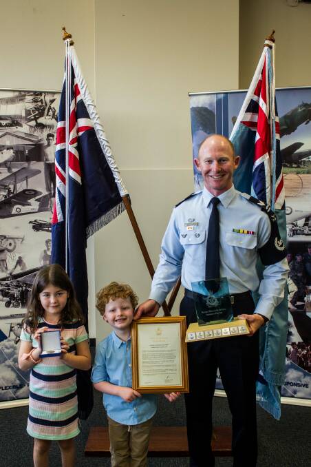 Sergeant Jospeph Munro with his children Noah, 4, and Charlotte, 8. 