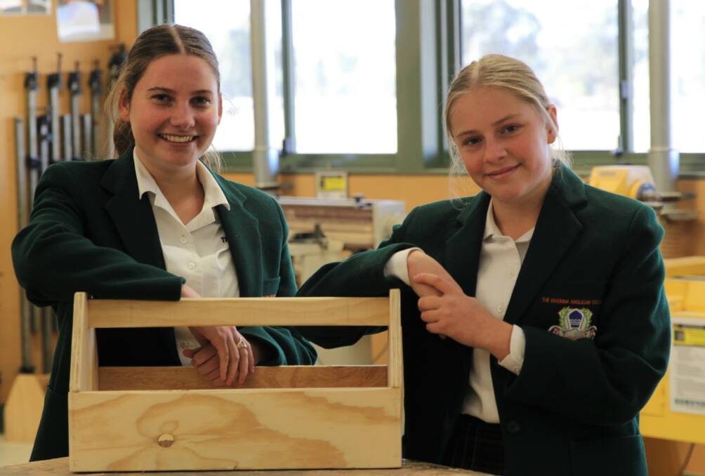 Building dreams: Riverina Anglican College year-nine students Grace McGrath and Shanika McLachlan are determined to take on trade apprenticeships next year, after completing a six-week Girls in Trade course at TAFE Wagga.