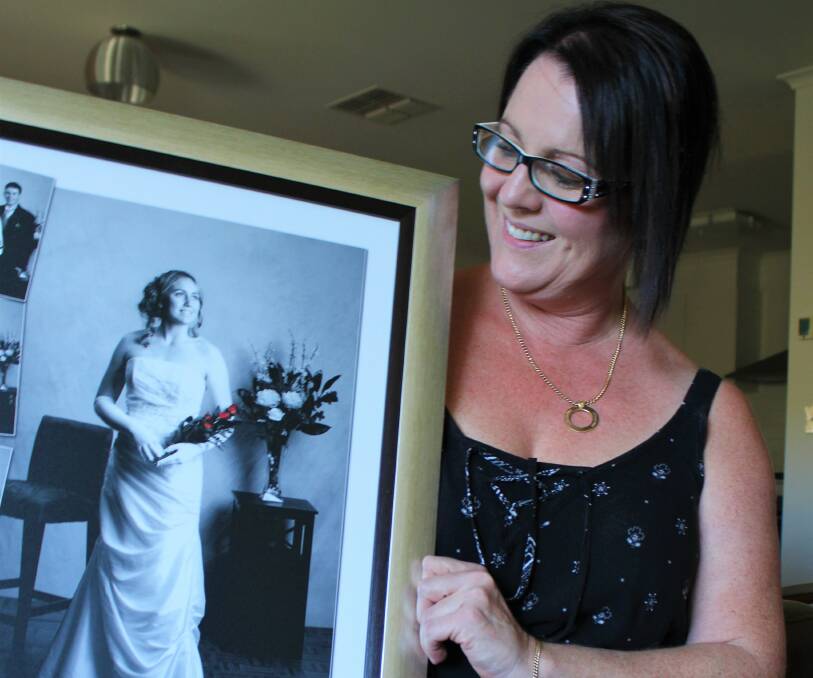 Memories: Jodie Wilesmith with a picture of her daughter, the late Shannon McKnight, at her debutante ball - 'the closest she would get to wearing a wedding gown'.