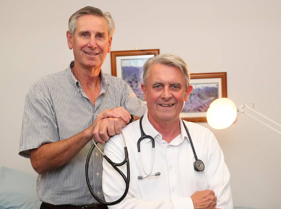 Doctor's advice: Peter Street Medical Centre's founding doctors, Peter Knight and Patrick Renshaw are hanging up their stethoscopes, following a four-decade friendship and business partnership. Picture: Kieren L Tilly 