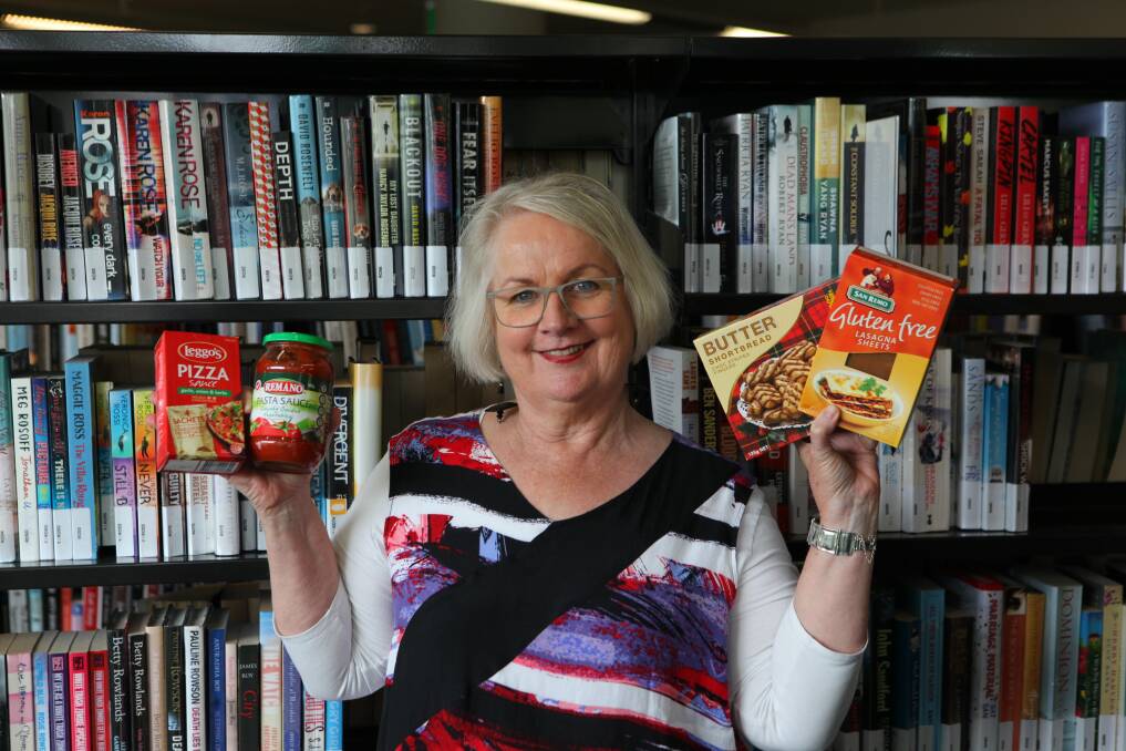 HELP: Claire Campbell, Manager Library Services encourages all library members to contribute to the annual Food for Fines Program.