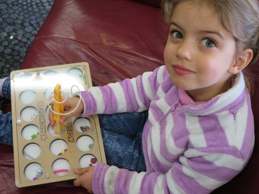 FUN, FUN, FUN: Livia Humphrey discovers what’s magnetic with the Magnetic Investigation Box.