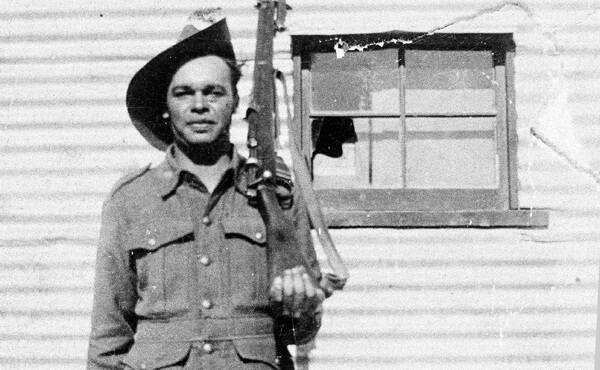 DUTY: Wilfred (Manty) Johnson outside his parents' home on the Mission in Condobolin. Wilfred was a great artist who’s school teacher wanted to send him to be formally trained. His mother wouldn’t let him go because of the fear of children being taken away. Picture: Aunty Gladys Newman. 