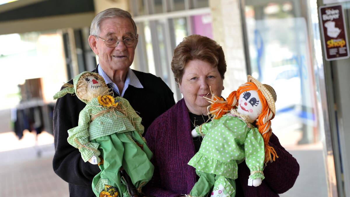 TWO PEAS IN A POD: Colin Patterson and Margaret Majury with some baby scarecrows for the Coolamon scarecrow festival. Picture: Les Smith