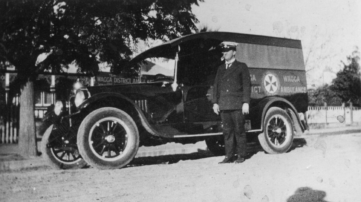 EARLY DAYS: This is a photograph of what is probably the first ambulance belonging to the Wagga Wagga District Ambulance Service. The officer is likely to be the first Superintendent, Mr Fred Roffe. Picture: Murrumbidgee District Ambulance Service Collection, SA1933