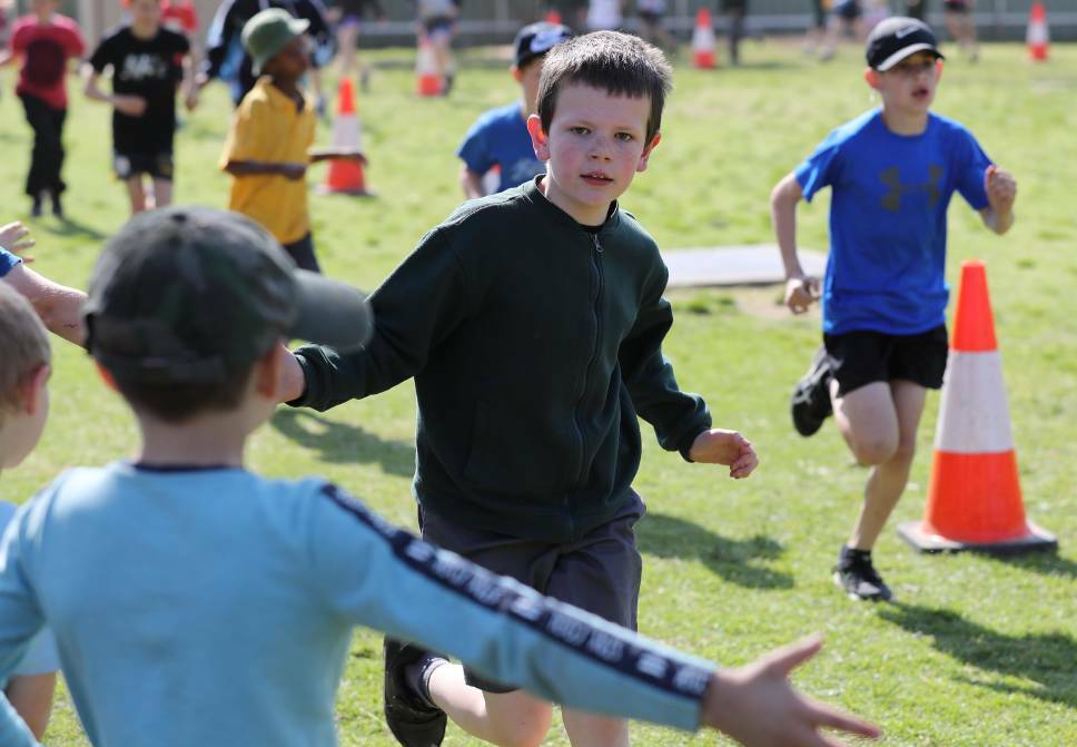 RUN FOR A CAUSE: It was high fives all round for Jackson Tilly during the North Wagga Public School Fun Run. Picture: Les Smith
