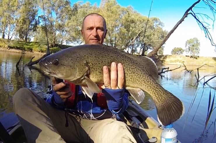 HOOK, LINE, SINKER: Craig Elphic with a trout caught in the Murrumbidgee River recently. Send your pictures to craig@wagganarine.com.au or 0419 493 313. Picture: Contributed