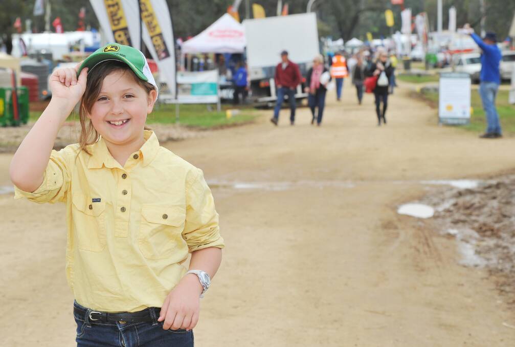 OUTDOOR ADVENTURE: Lara Wells, 8, of Wallendbeen, enjoys the Henty Machinery Field Days on Tuesday. Find more pictures from the field days at www.dailyadvertiser.com.au. Picture: Kieren L Tilly